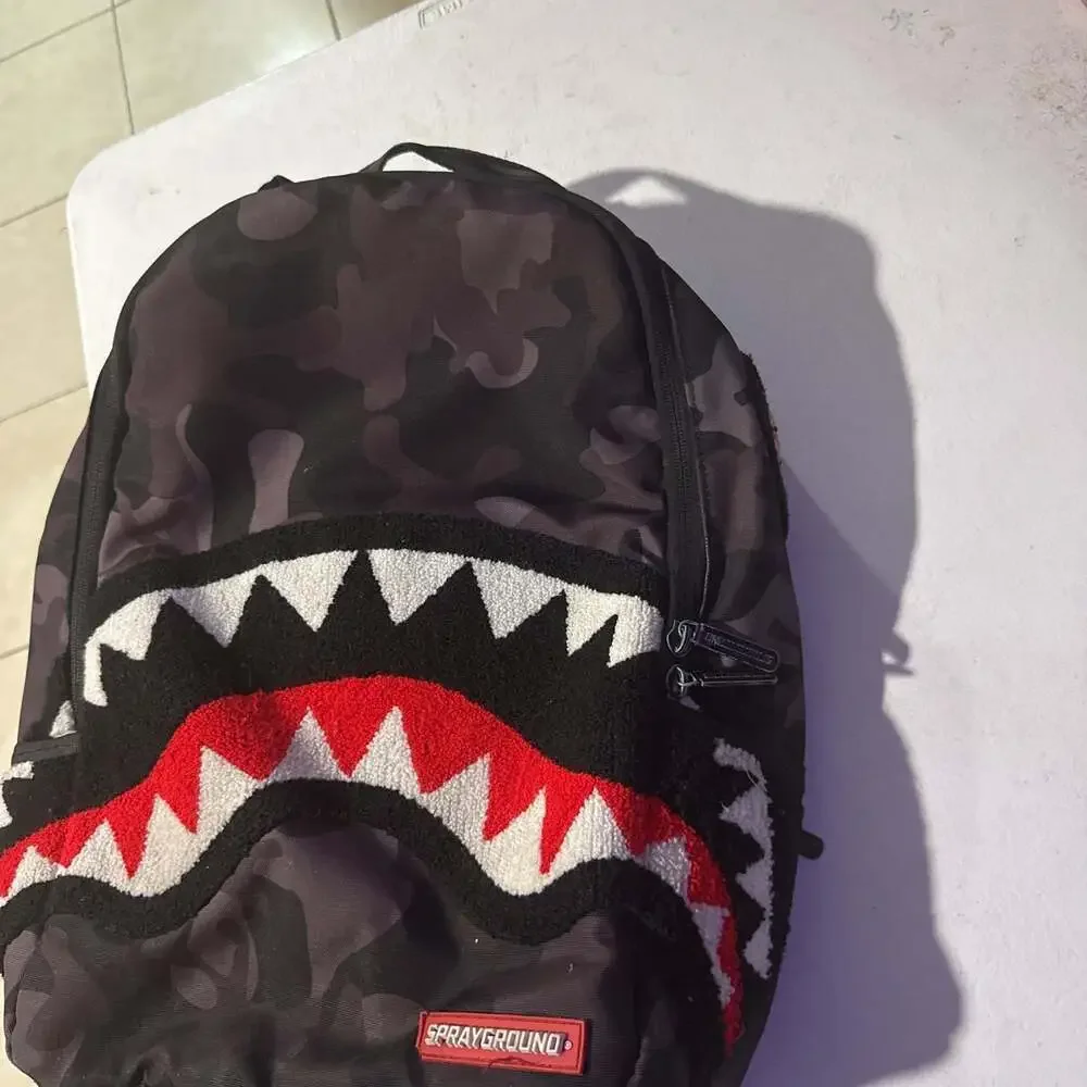 Sprayground Black Camo Shark Mouth Backpack